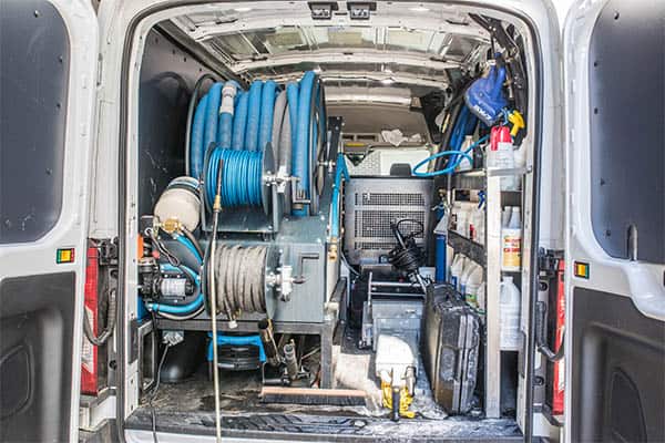 Powerful commercial carpet cleaning machine mounted in a brand new van
