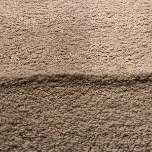 Wrinkled tan carpet