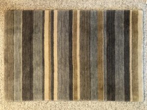 Wool Striped Rug over Carpet