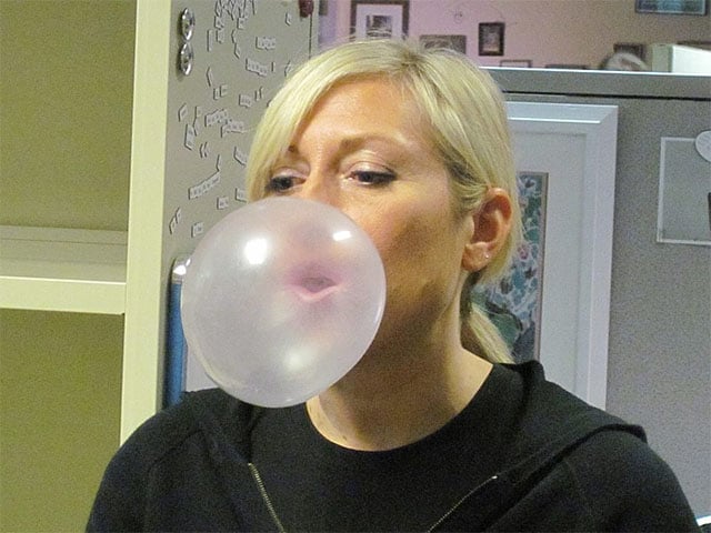 Girl blowing bubble with bubble gum