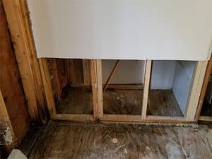 Drywall removed from wall due to water damage