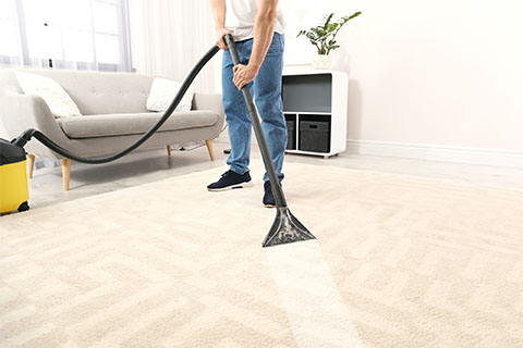 Man with rented carpet extractor